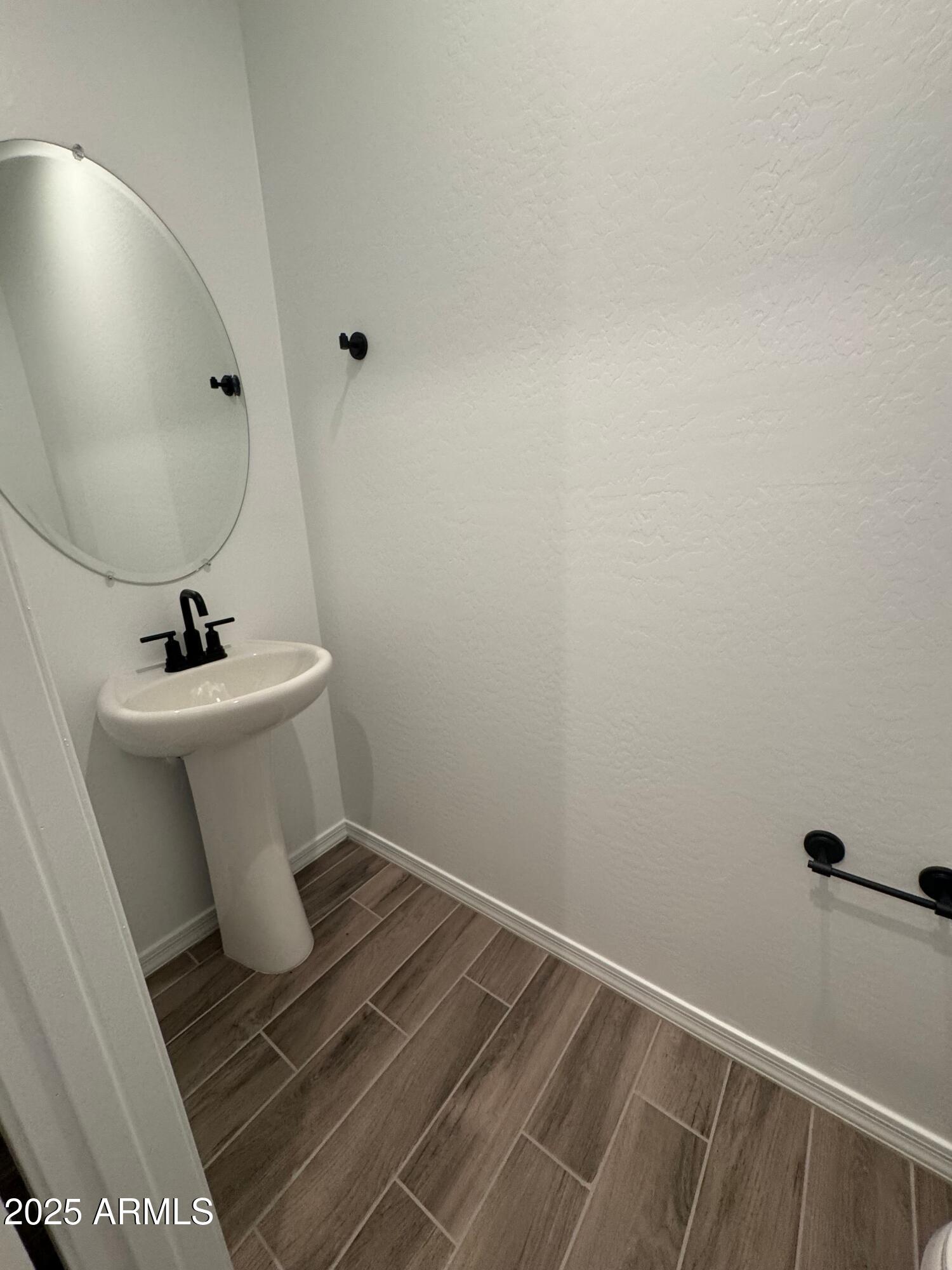 13420 West Eagle Feather Road Peoria, AZ 85383 - Photo 13 of 23 a bathroom with a sink toilet and mirror