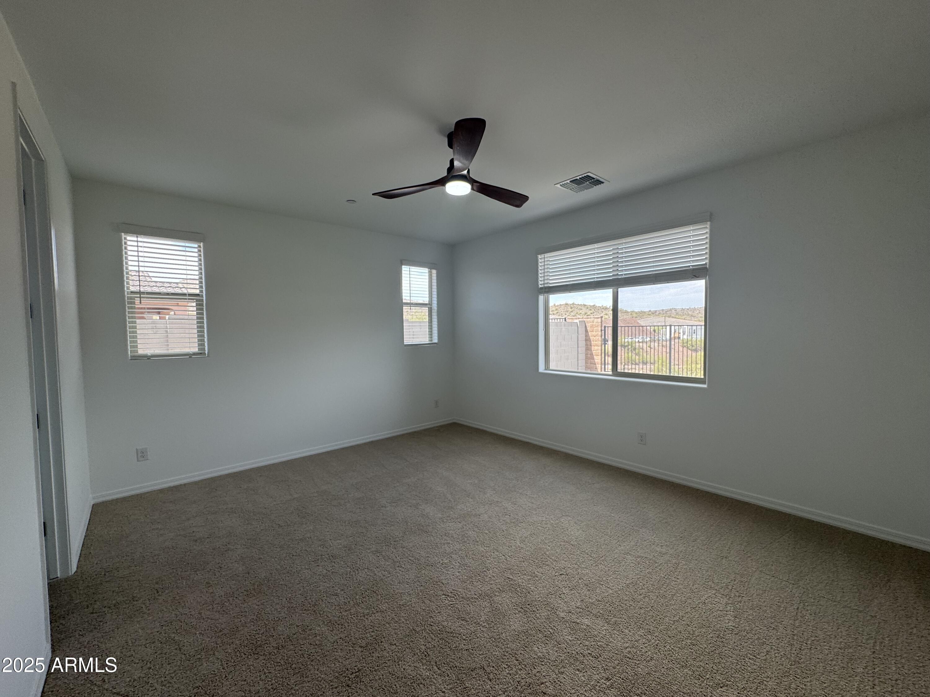 13420 West Eagle Feather Road Peoria, AZ 85383 - Photo 15 of 23 a view of an empty room with a window