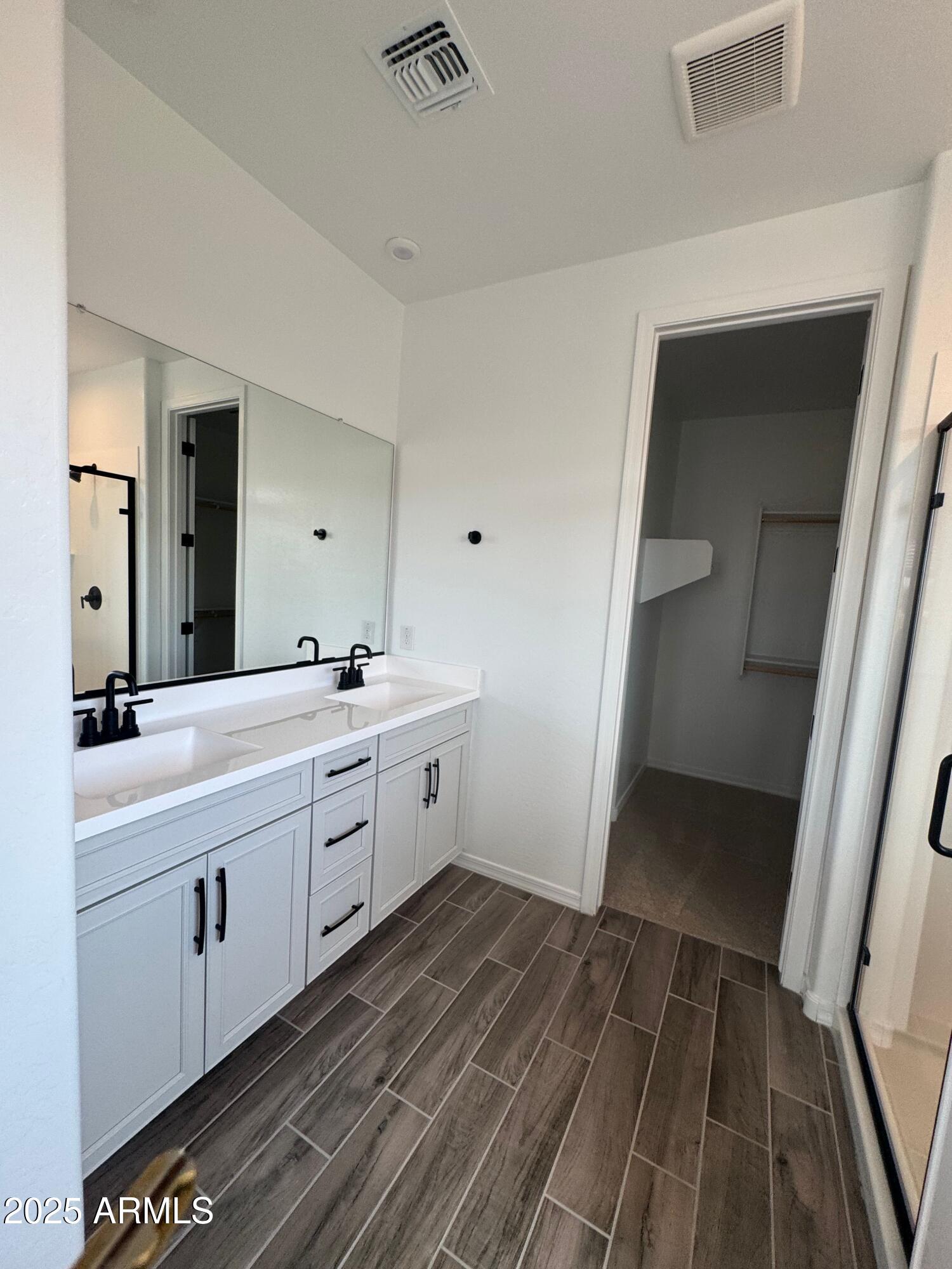 13420 West Eagle Feather Road Peoria, AZ 85383 - Photo 16 of 23 a bathroom with a sink and a mirror