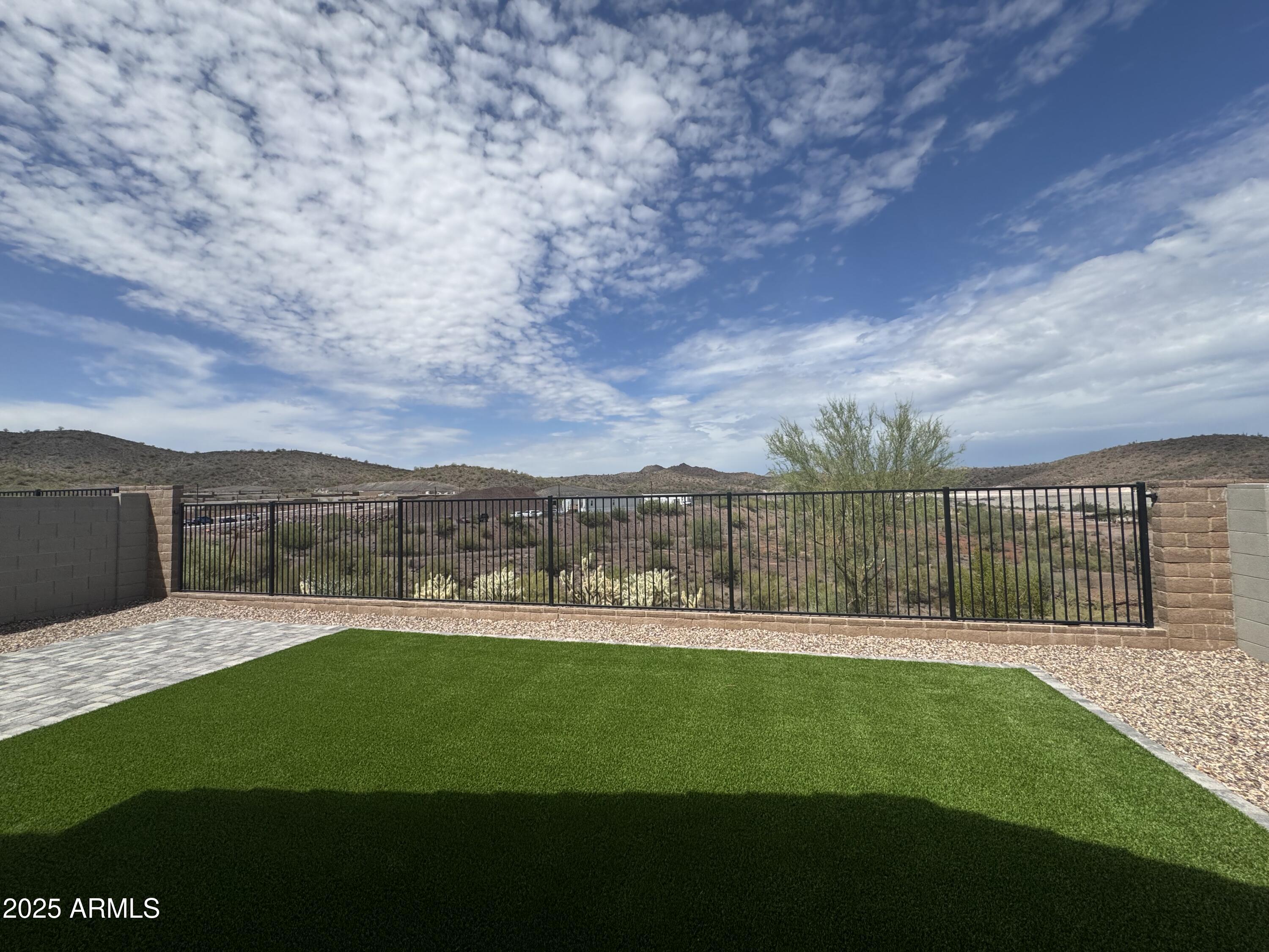 13420 West Eagle Feather Road Peoria, AZ 85383 - Photo 19 of 23 a view of a backyard with a garden and plants