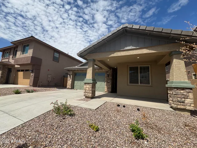 a yellow house with a outdoor space