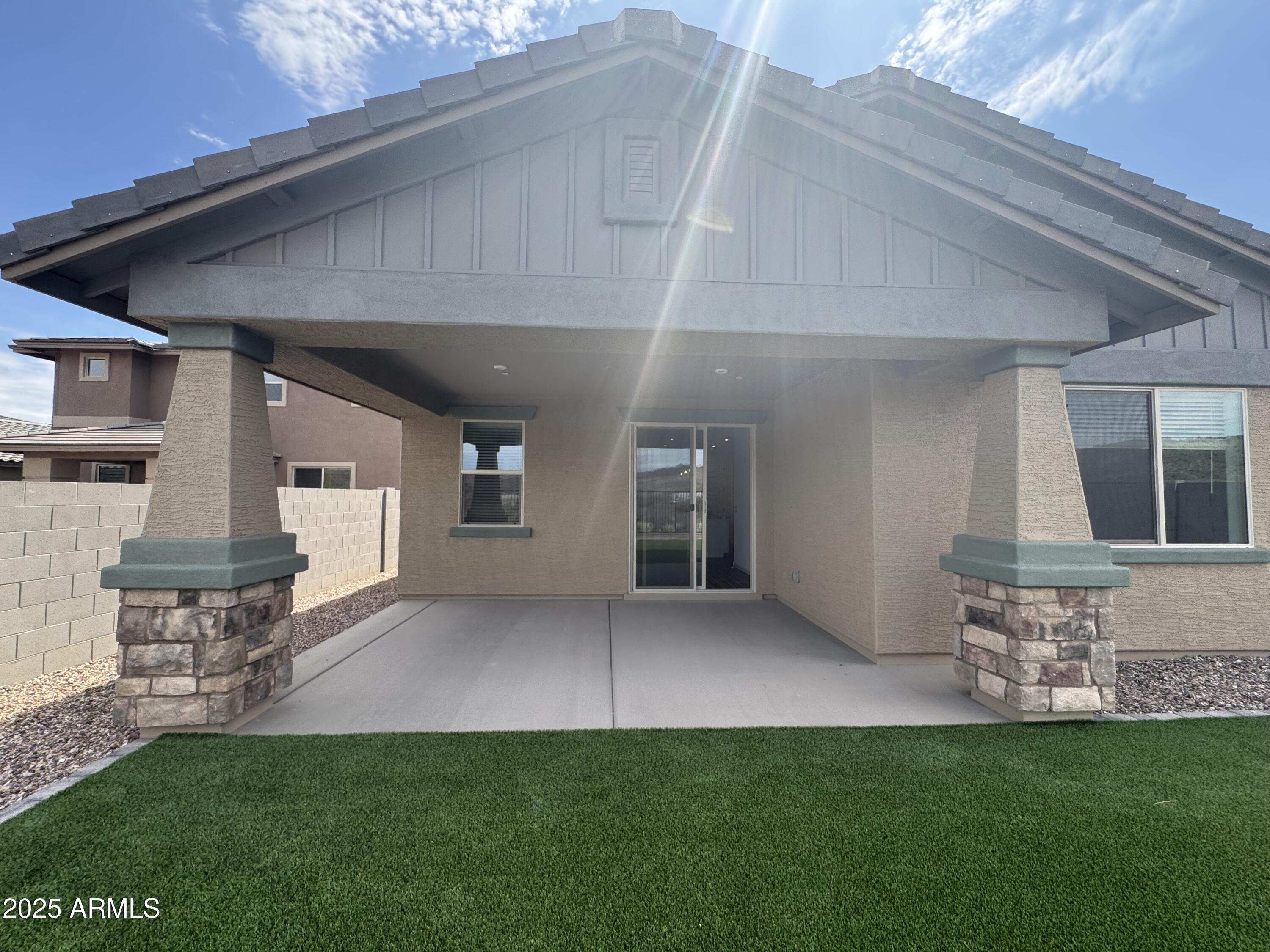13420 West Eagle Feather Road Peoria, AZ 85383 - Photo 22 of 23 a view of an house with backyard porch and furniture