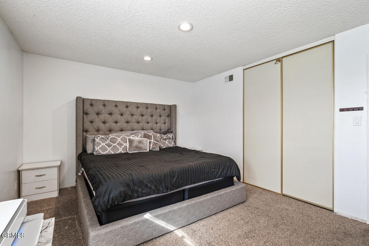 2117 Miramar Walk Oxnard, CA 93035 - Photo 12 of 30 a bedroom with a bed and a night stand