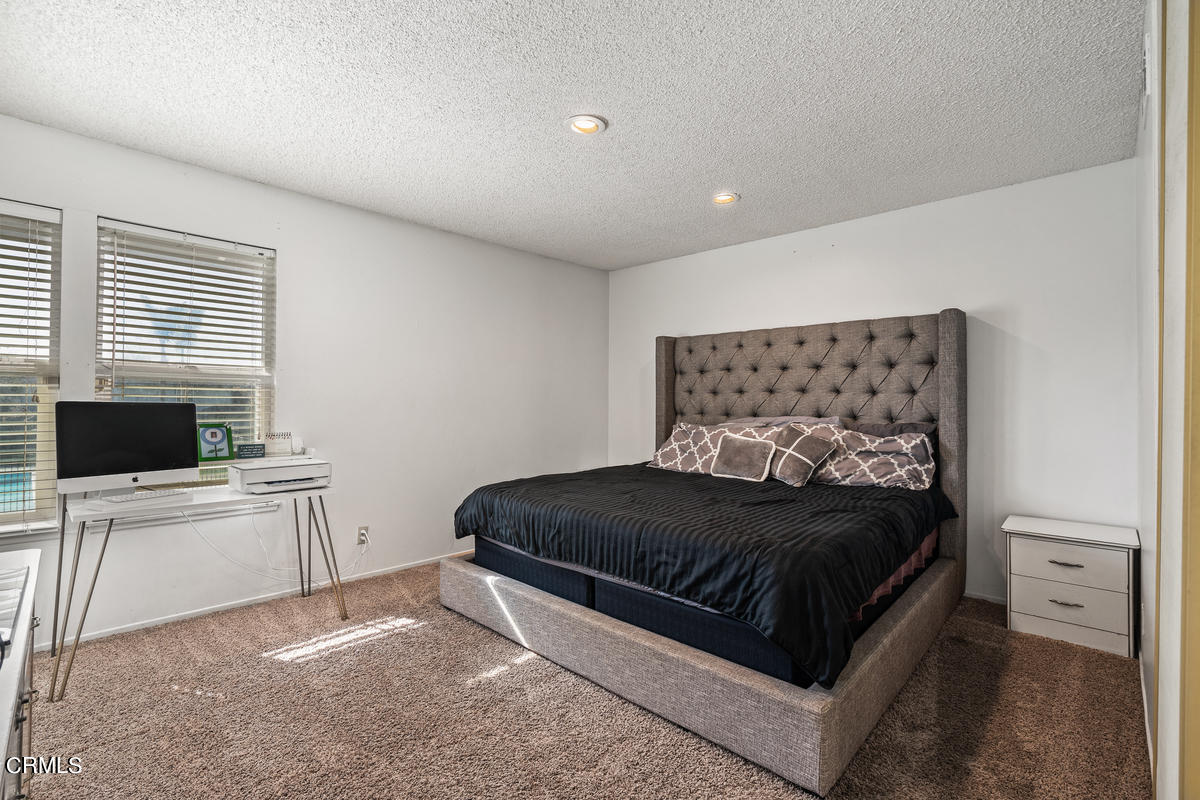 2117 Miramar Walk Oxnard, CA 93035 - Photo 15 of 30 a bedroom with a white bed and white furniture