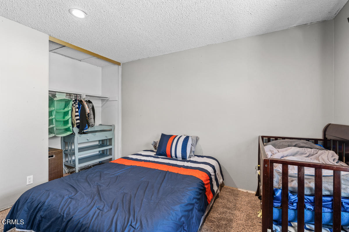 2117 Miramar Walk Oxnard, CA 93035 - Photo 16 of 30 a bedroom with a bed and a window
