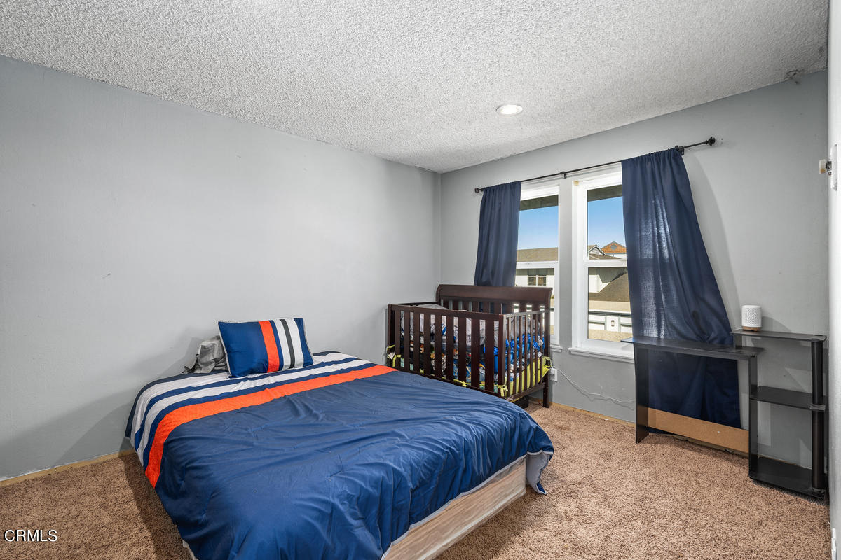 2117 Miramar Walk Oxnard, CA 93035 - Photo 17 of 30 a bed sitting in a bedroom next to a window