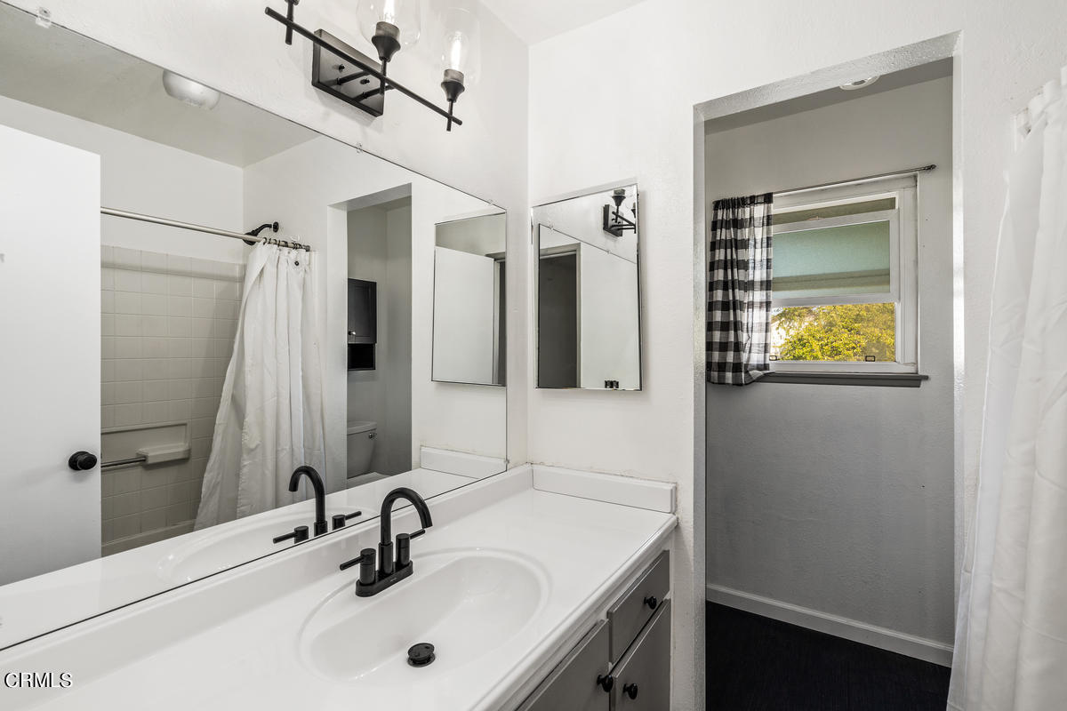 2117 Miramar Walk Oxnard, CA 93035 - Photo 18 of 30 a bathroom with a sink and a mirror