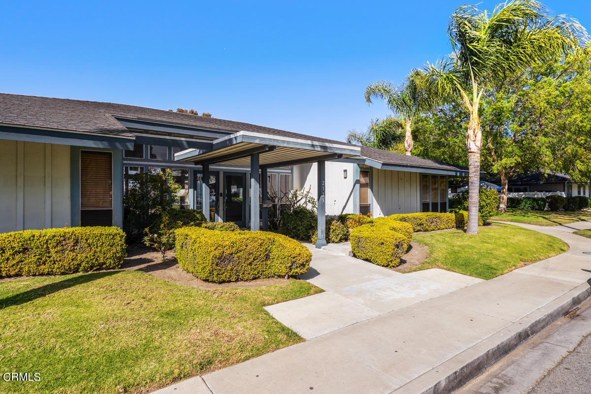 2117 Miramar Walk Oxnard, CA 93035 - Photo 19 of 30 a house view with swimming pool and wooden fence