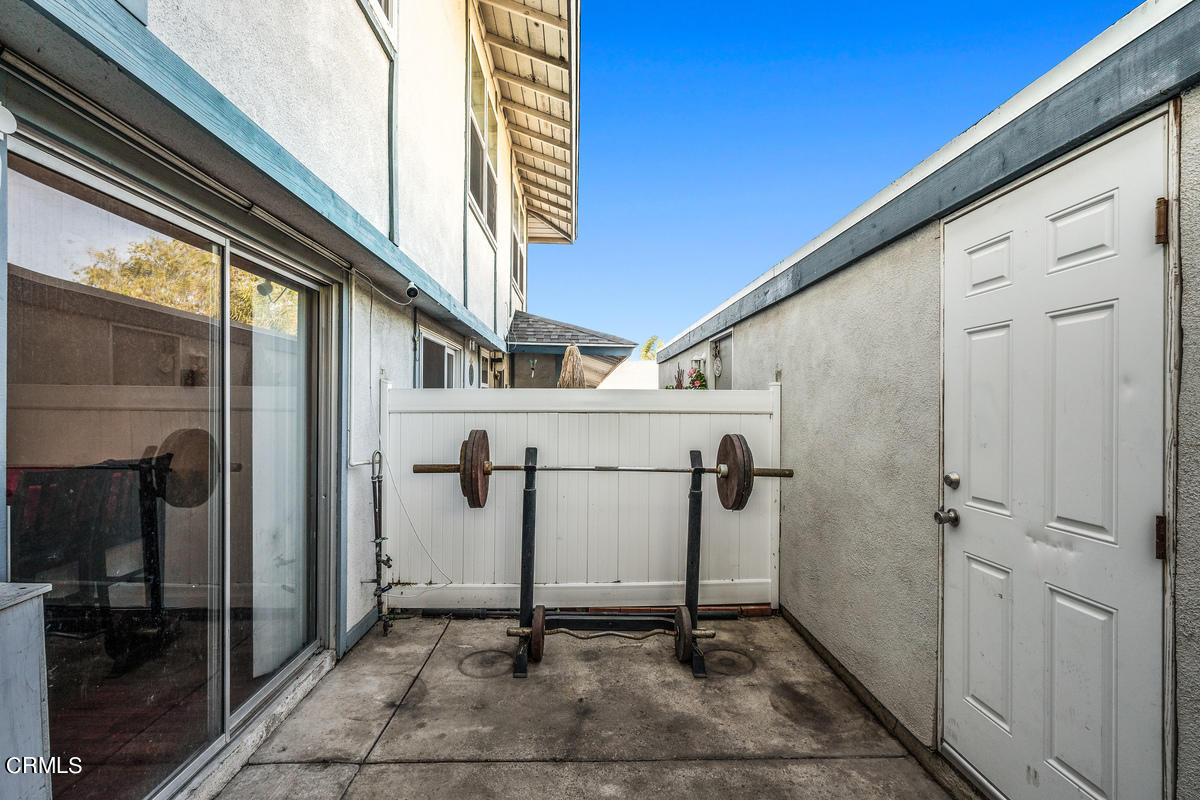 2117 Miramar Walk Oxnard, CA 93035 - Photo 21 of 30 a view of a porch with a door and wooden walls
