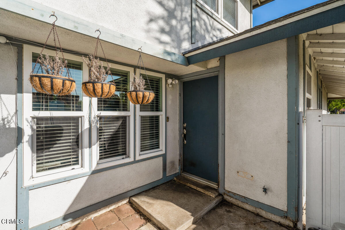 2117 Miramar Walk Oxnard, CA 93035 - Photo 25 of 30 a view of a house with a door and a window