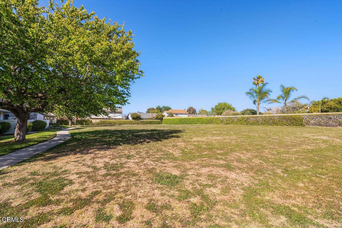 2117 Miramar Walk Oxnard, CA 93035 - Photo 27 of 30 a view of a lake with a yard