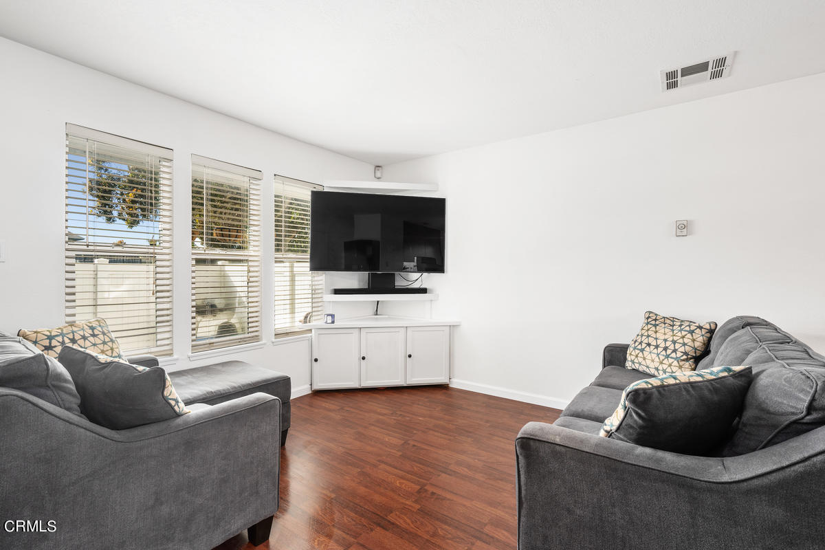 2117 Miramar Walk Oxnard, CA 93035 - Photo 4 of 30 a living room with furniture and a flat screen tv