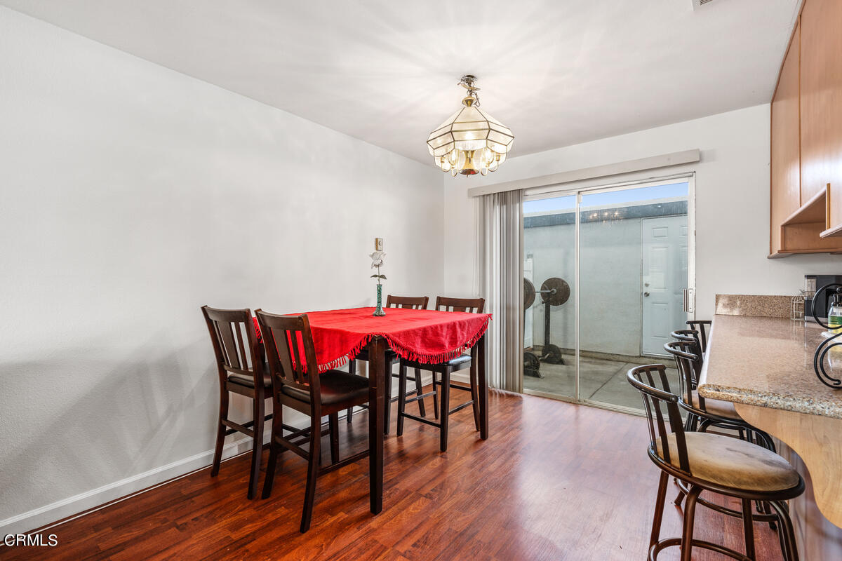2117 Miramar Walk Oxnard, CA 93035 - Photo 6 of 30 a view of a dining room with furniture and wooden floor