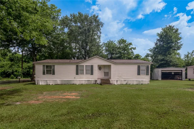 a house with trees in the background