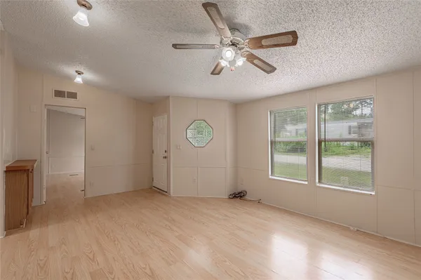 a view of an empty room with a window