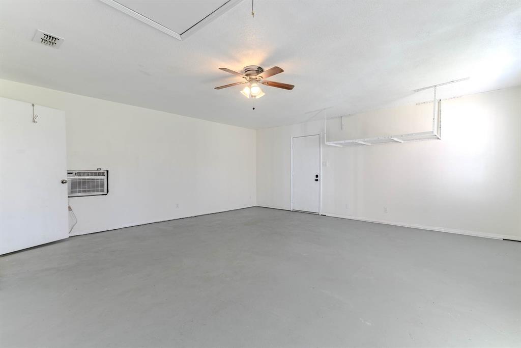 505 Meadow Ridge Drive Cedar Hill, TX 75104 - Photo 24 of 32 wooden floor in an empty room with a window