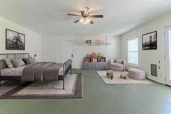 a bedroom with furniture and a chandelier