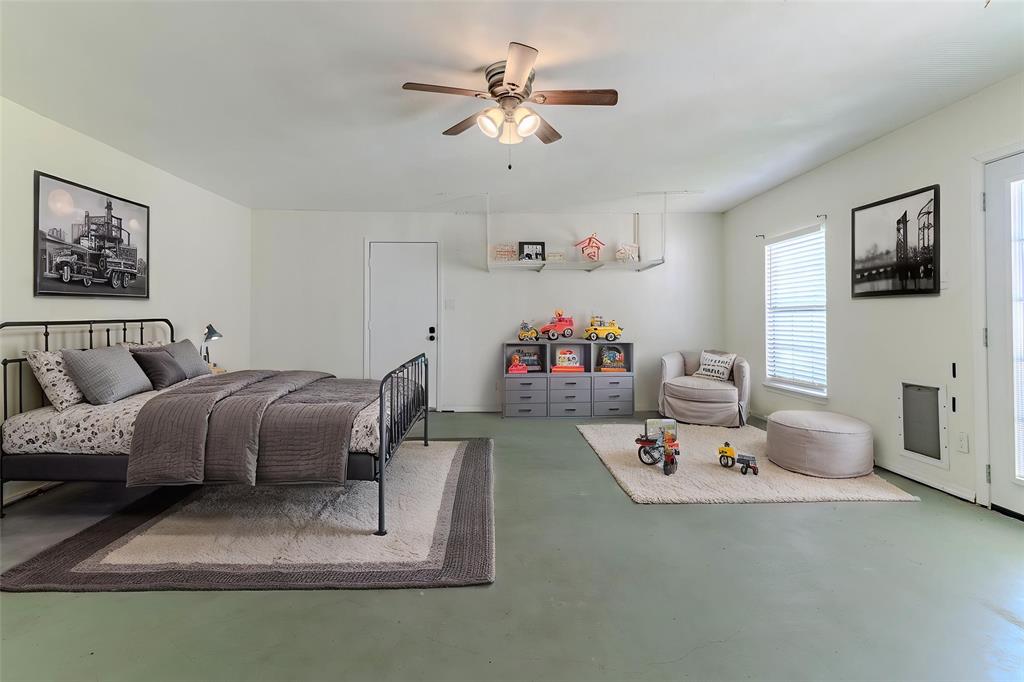 505 Meadow Ridge Drive Cedar Hill, TX 75104 - Photo 25 of 32 a bedroom with furniture and a chandelier