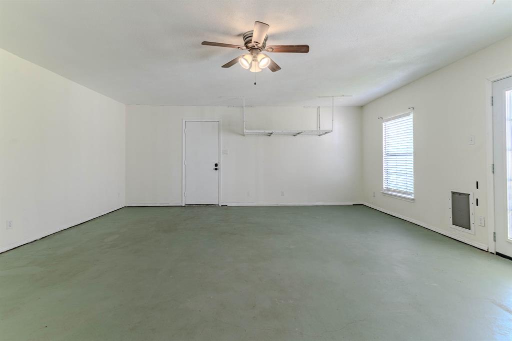 505 Meadow Ridge Drive Cedar Hill, TX 75104 - Photo 27 of 32 an empty room with chandelier fan and windows