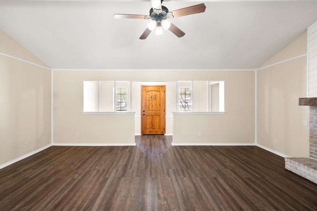505 Meadow Ridge Drive Cedar Hill, TX 75104 - Photo 3 of 32 a view of empty room with wooden floor and fan