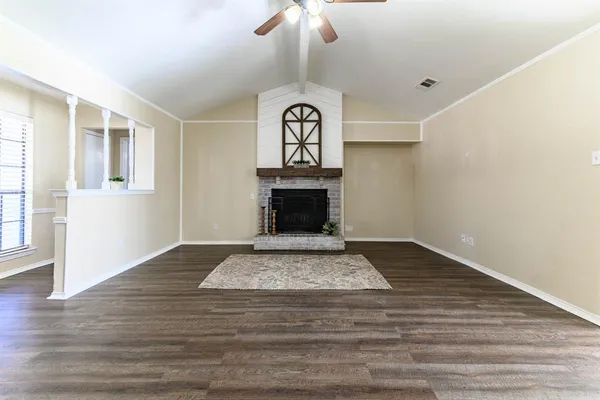 a view of fireplace and wooden floor