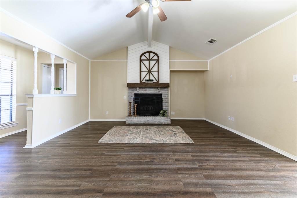 505 Meadow Ridge Drive Cedar Hill, TX 75104 - Photo 4 of 32 a view of fireplace and wooden floor