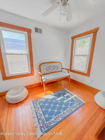a kitchen with blue sink and a large window