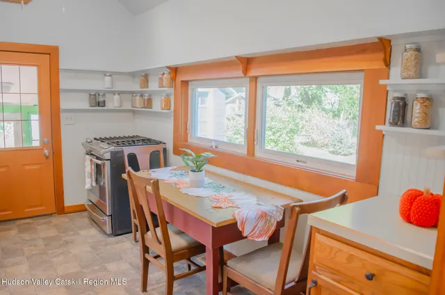 a view of living room with furniture and baby crib