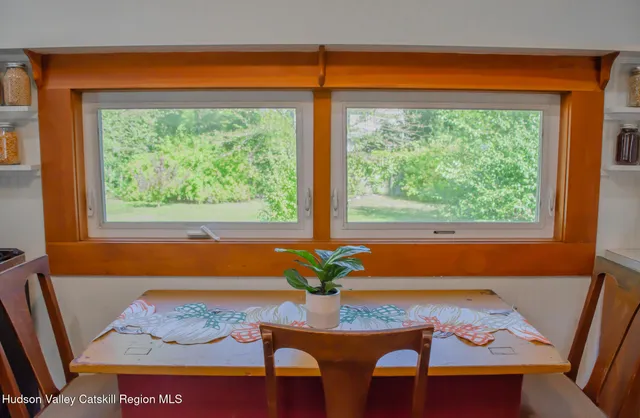 a view of a bedroom with a large window