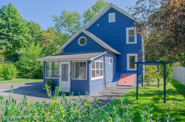 a view of garden with plants and trees