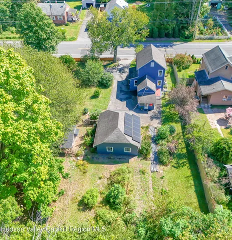 an aerial view of a house with a garden