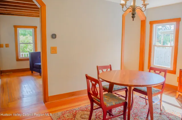 a dining room with furniture and window