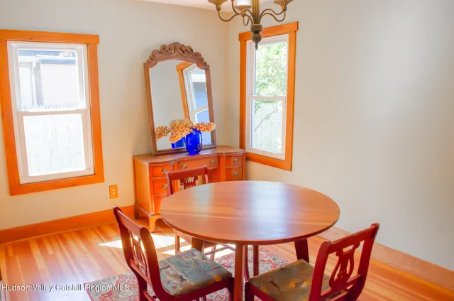 a balcony with table and chairs