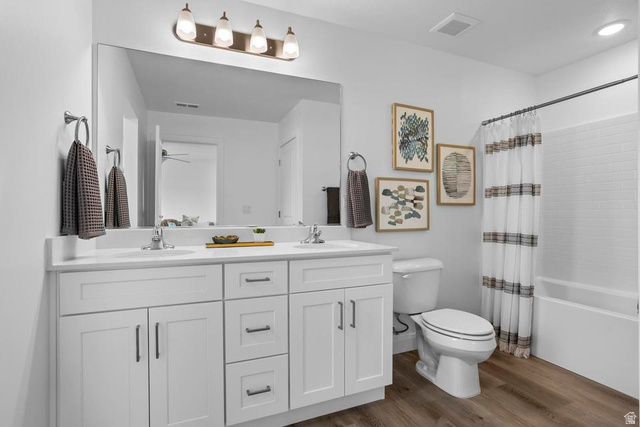 488 West Greenstone Pl Street, Unit 1010 St. George, UT 84790 - Photo 26 of 34 Dual-sink vanity with white cabinetry and integrated sinks