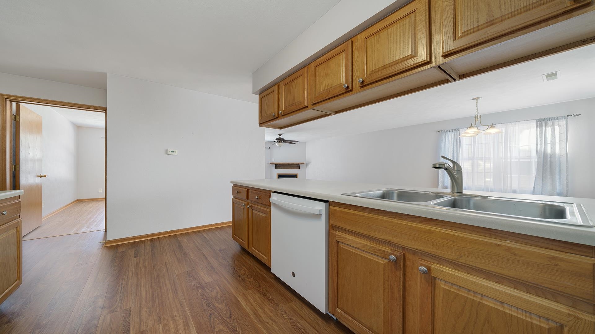 443 Mill Ridge Drive Byron, IL 61010 - Photo 11 of 25 a kitchen with stainless steel appliances granite countertop a sink and cabinets