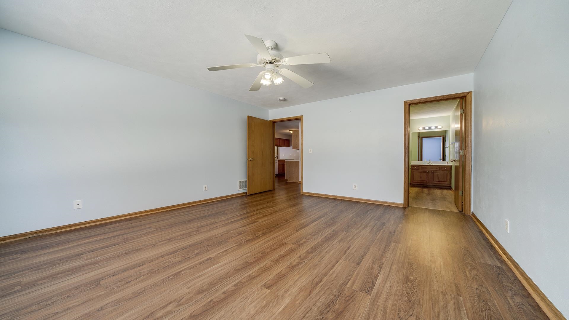 443 Mill Ridge Drive Byron, IL 61010 - Photo 19 of 25 wooden floor in an empty room with a window