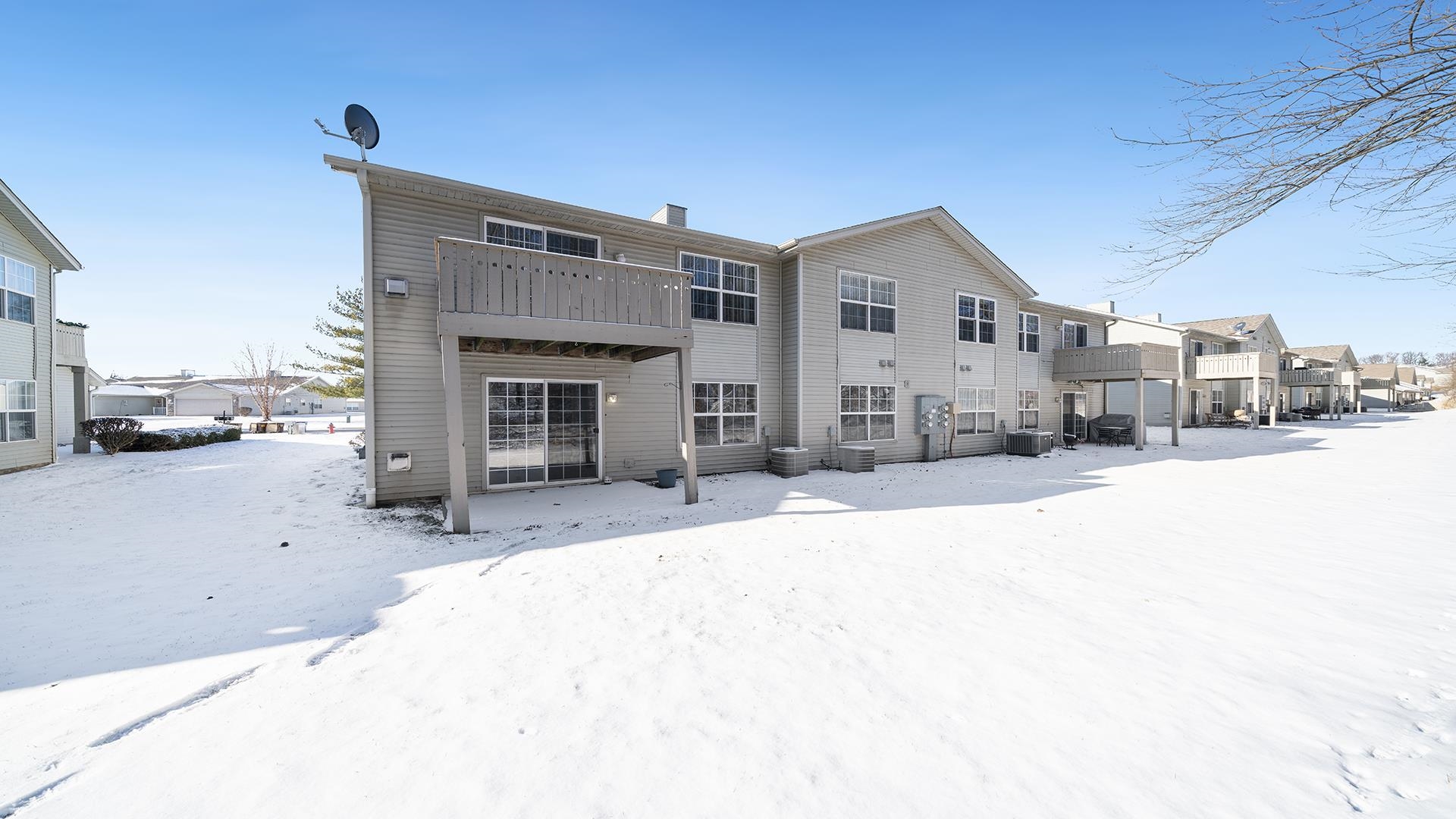 443 Mill Ridge Drive Byron, IL 61010 - Photo 23 of 25 a view of a house with a snow in the background