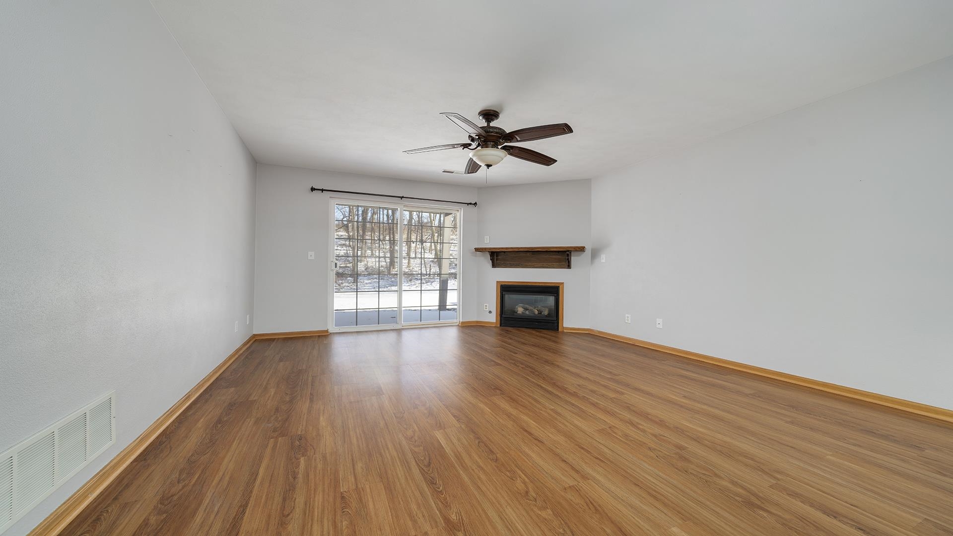 443 Mill Ridge Drive Byron, IL 61010 - Photo 5 of 25 a view of empty room with wooden floor and fan
