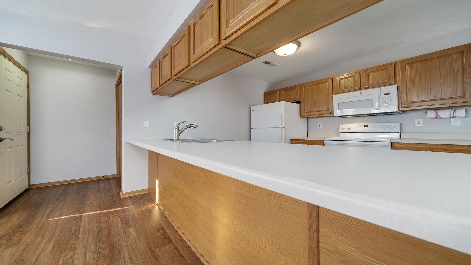 443 Mill Ridge Drive Byron, IL 61010 - Photo 8 of 25 a kitchen with stainless steel appliances a sink a stove and a refrigerator