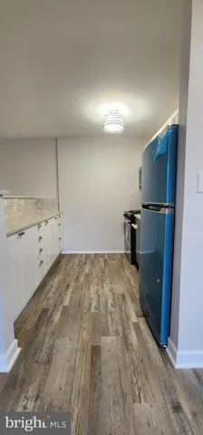 a view of a storage & utility room with empty racks