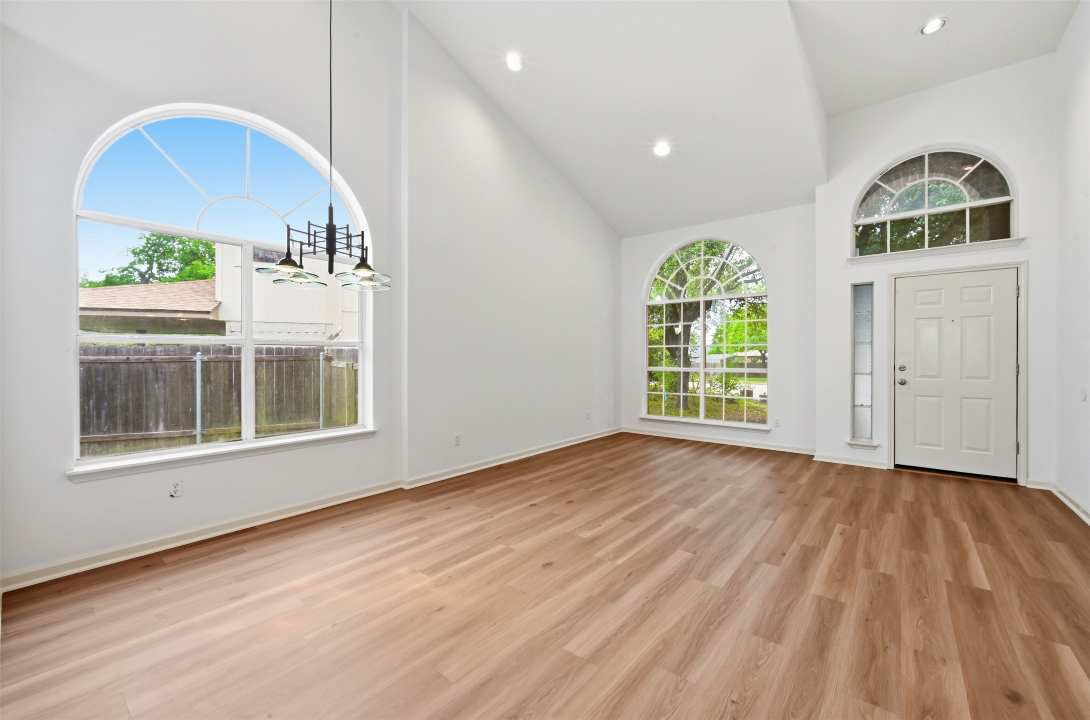3629 Ruby Red Drive Austin, TX 78728 - Photo 5 of 35 Formal Dining, Living, and Foyer featuring ample natural light and lofted ceiling