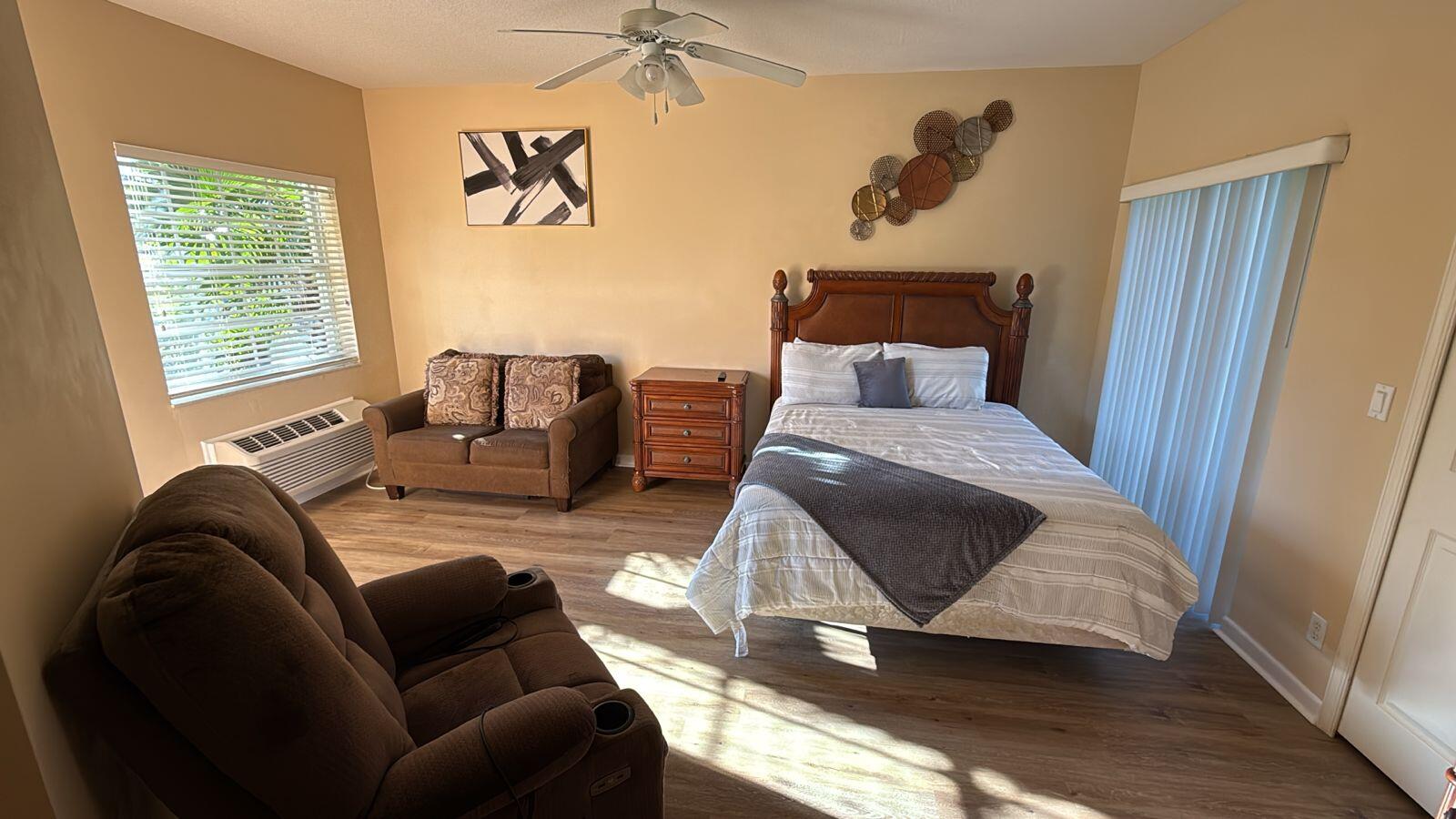 8294 Mulligan Circle, Unit B Port St. Lucie, FL 34986 - Photo 1 of 15 a living room with furniture and a window