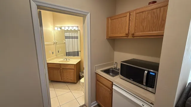 a view of a kitchen with a sink and dishwasher