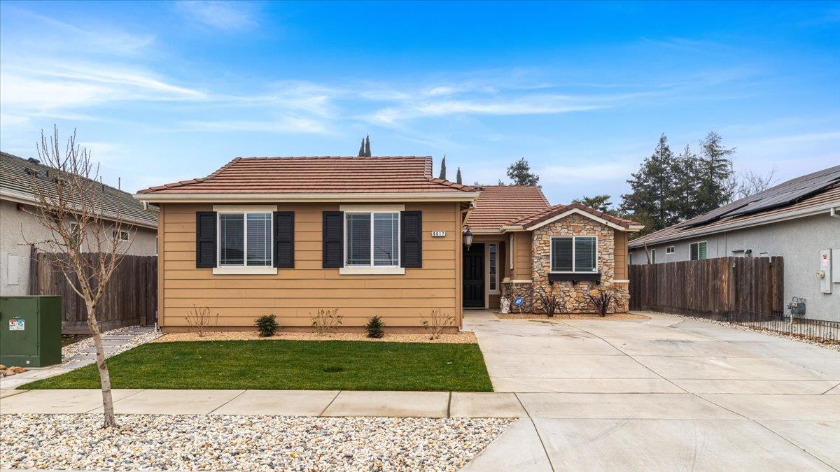 6617 Cervi Road Riverbank, CA 95367 - Photo 2 of 51 a front view of a house with a yard
