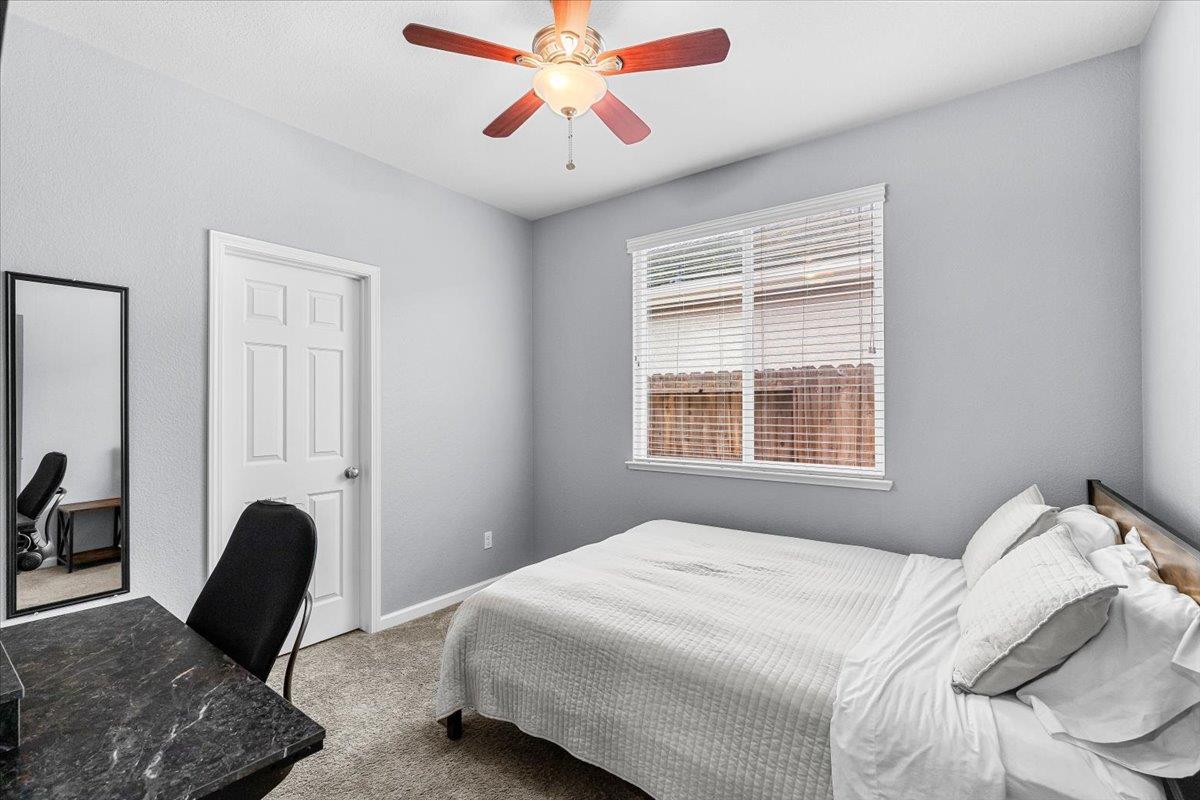 6617 Cervi Road Riverbank, CA 95367 - Photo 26 of 51 a bedroom with a bed and a chair