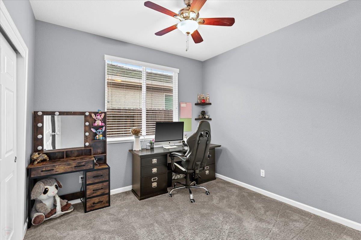 6617 Cervi Road Riverbank, CA 95367 - Photo 30 of 51 a view of a workspace with furniture and a window