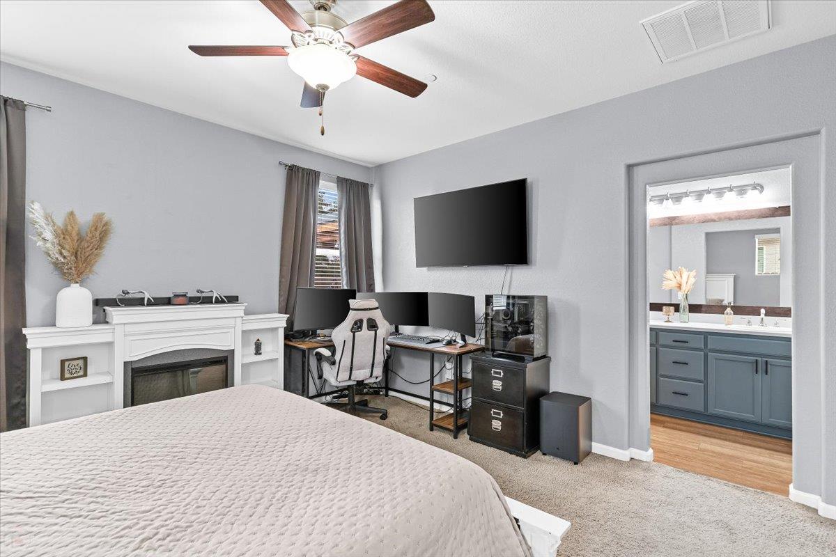 6617 Cervi Road Riverbank, CA 95367 - Photo 33 of 51 a bedroom with a bed and a flat screen tv