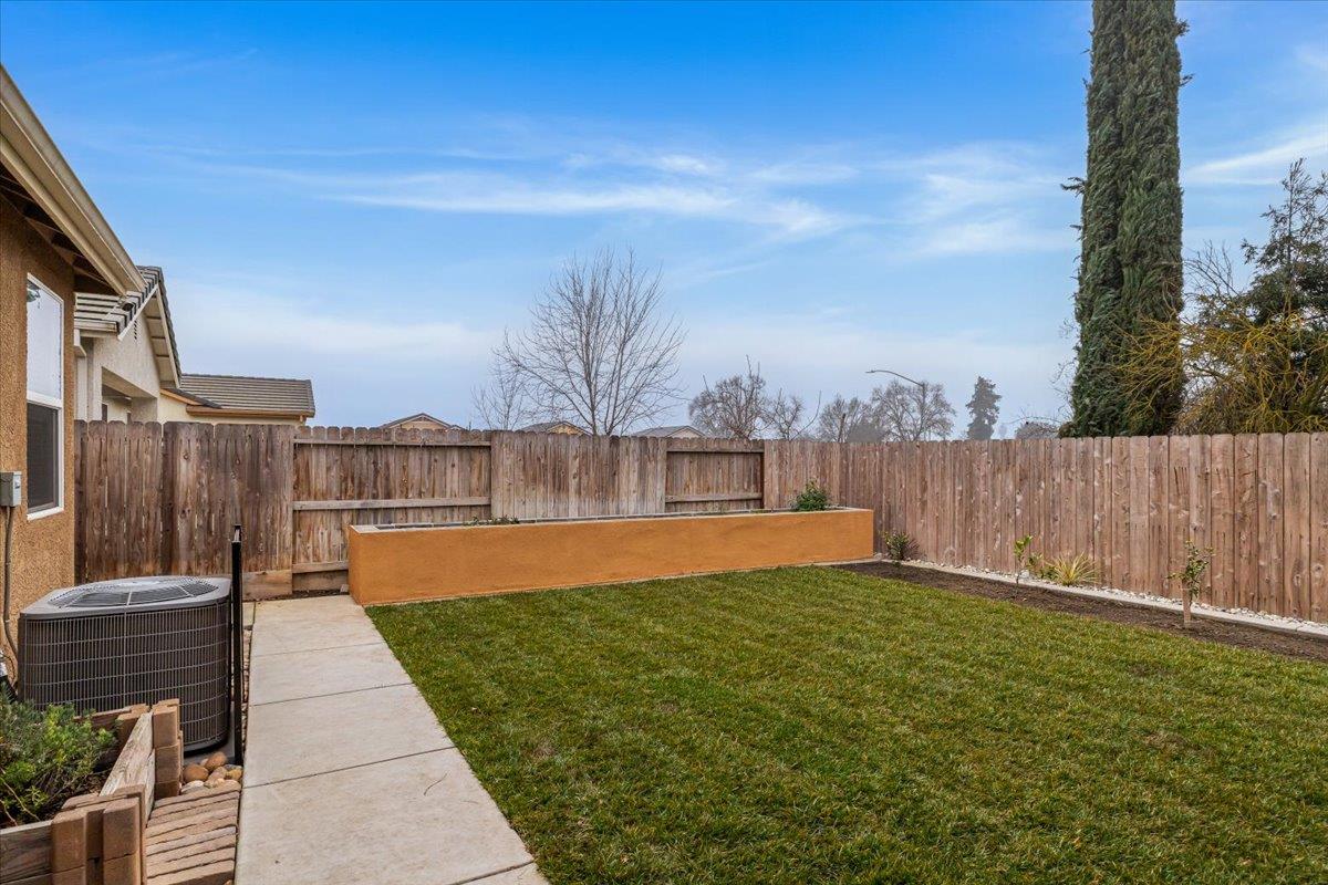 6617 Cervi Road Riverbank, CA 95367 - Photo 46 of 51 a view of a swimming pool with a yard