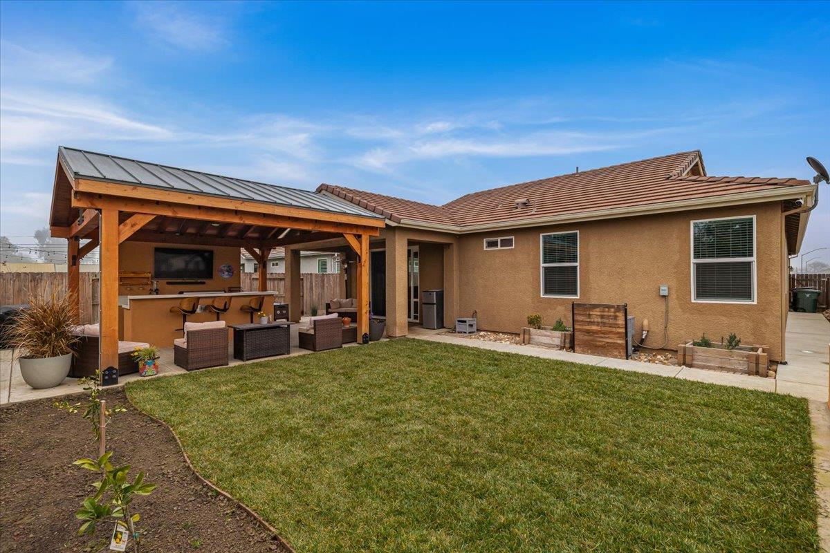 6617 Cervi Road Riverbank, CA 95367 - Photo 48 of 51 a house view with a sitting space and garden