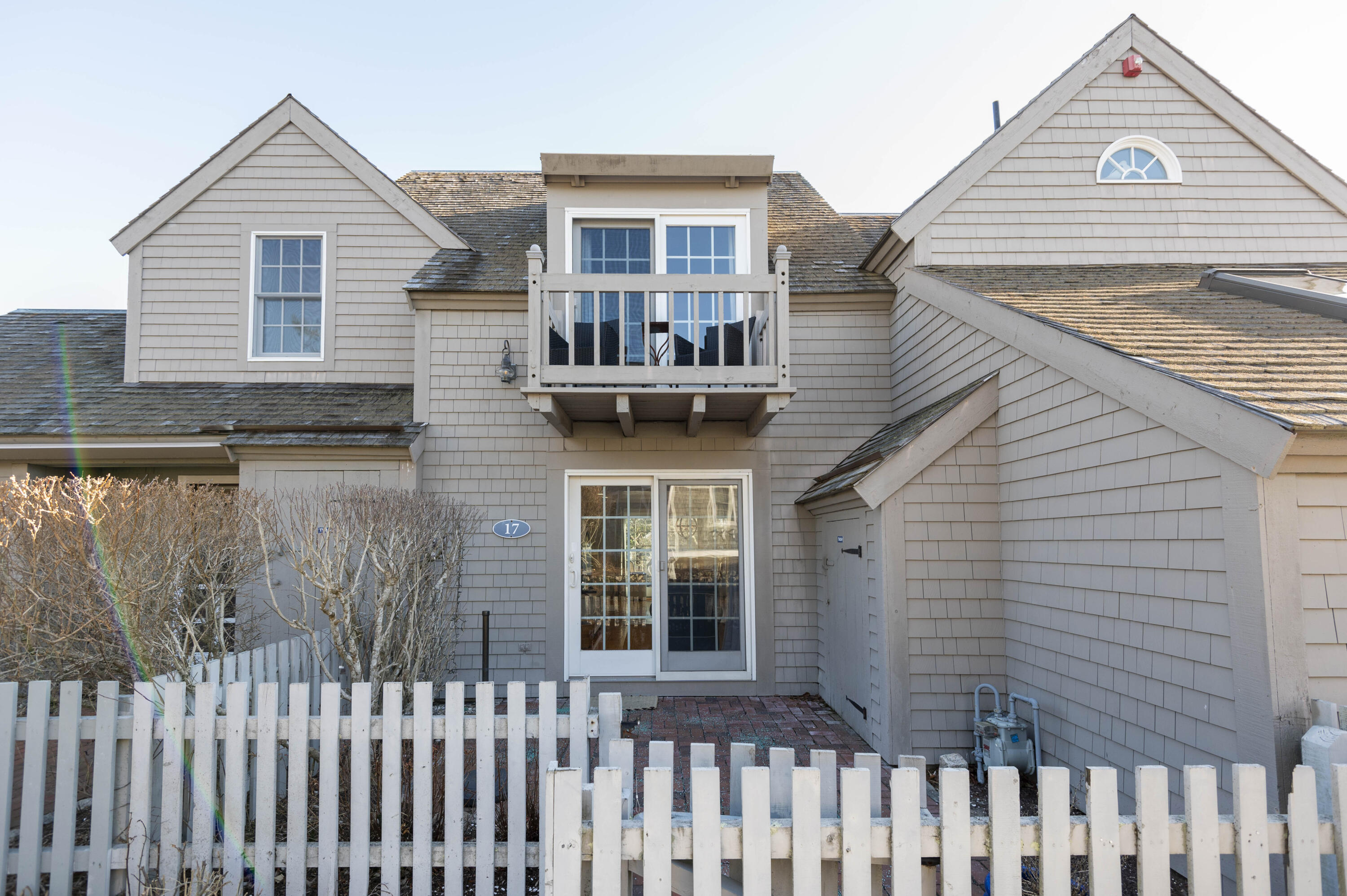 17 Brant Rock Road Mashpee, MA 02649 - Photo 3 of 37 a front view of a house with a porch